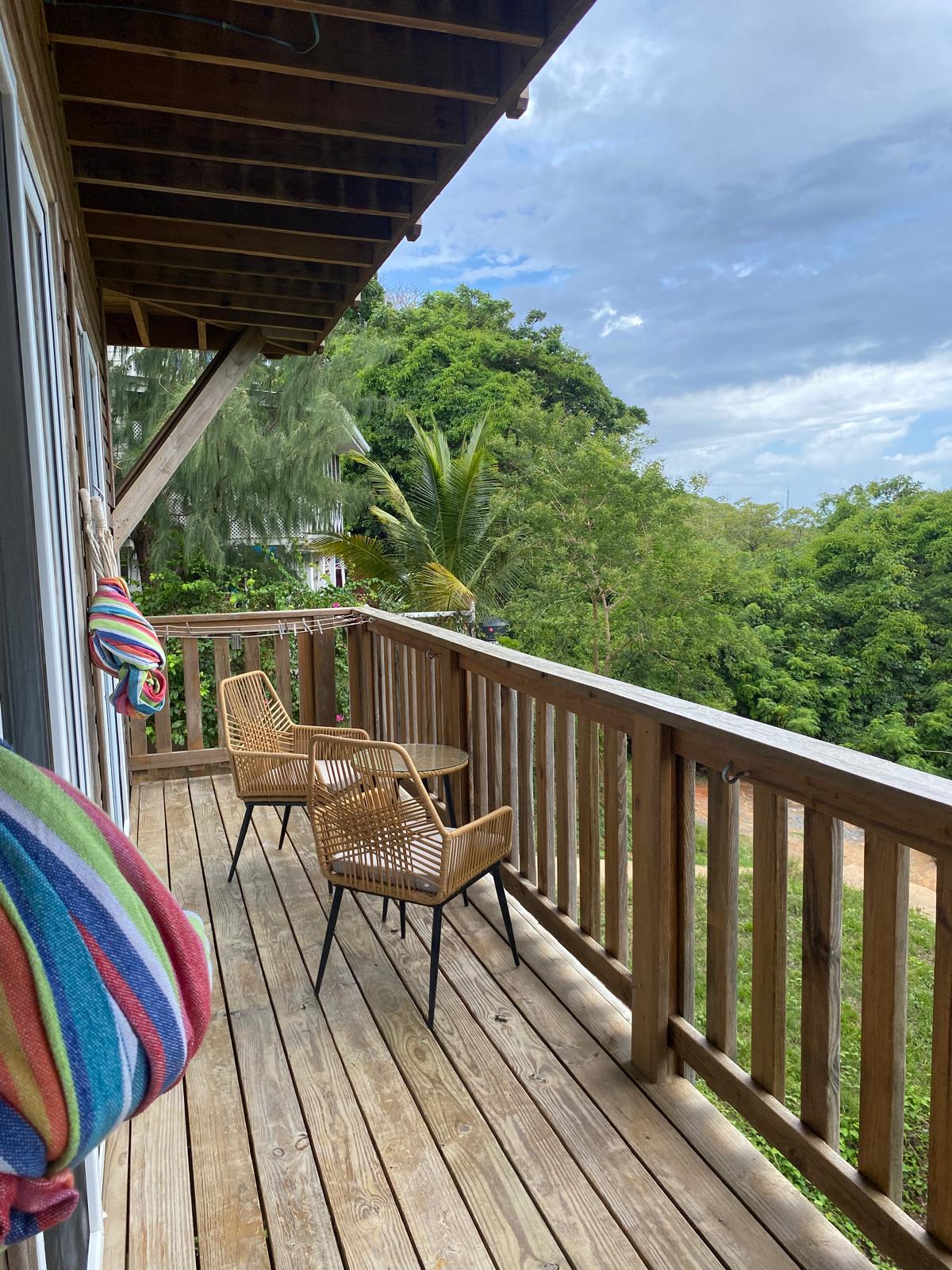 Room 2 private balcony overlooking the trees